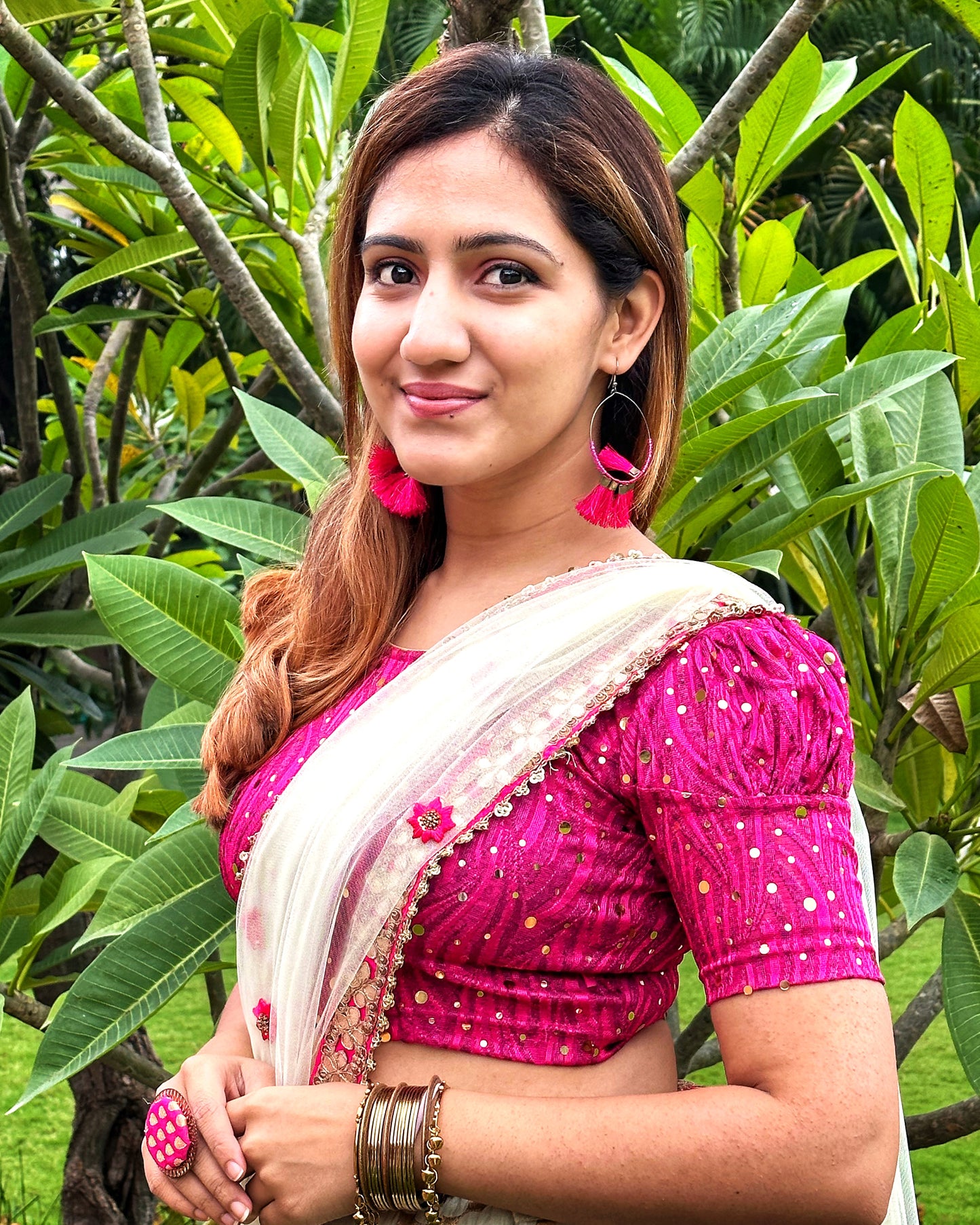 Model pairing the blouse with a saree for a festive occasion.
