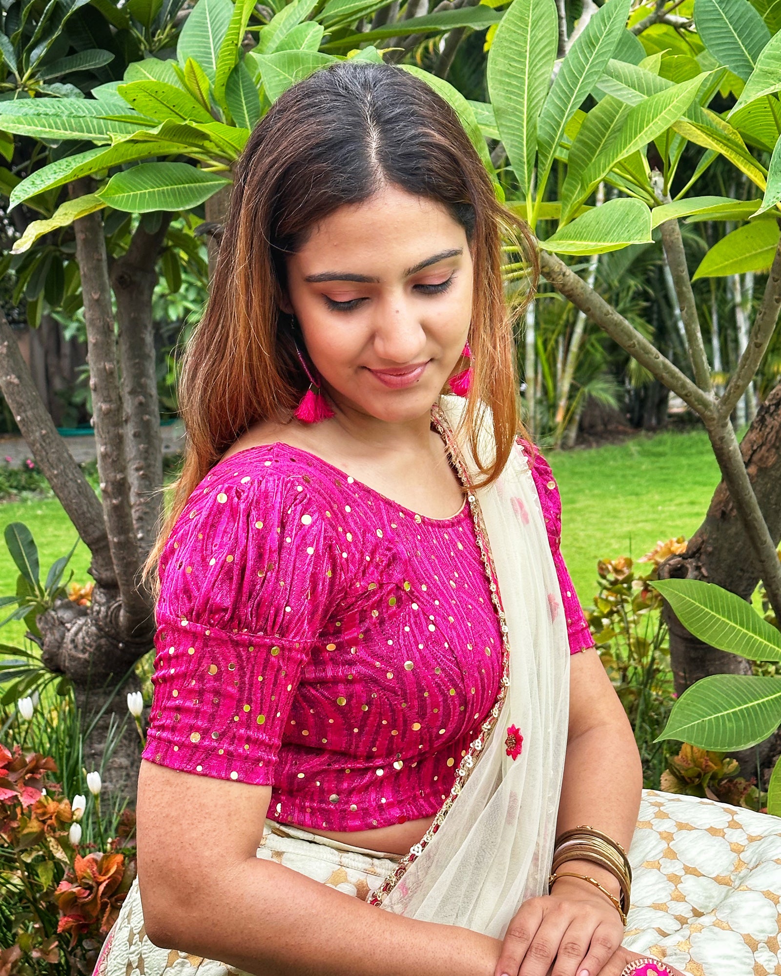 Model pairing the blouse with a saree for a festive occasion.