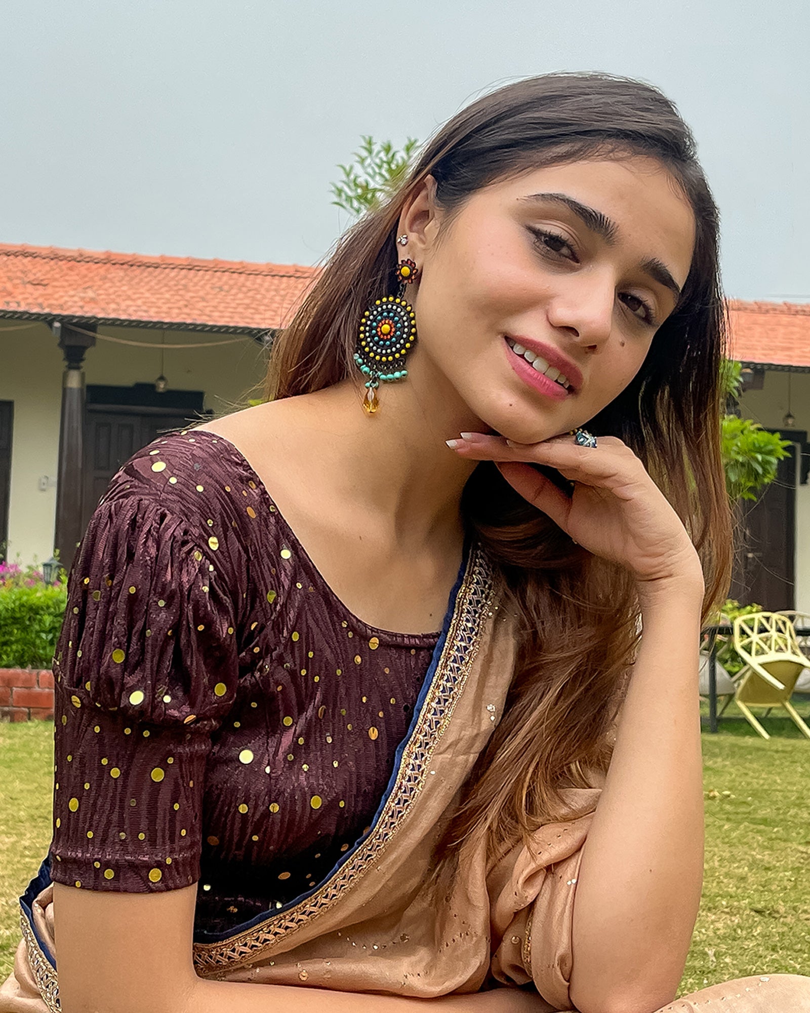 Model pairing the blouse with a saree for a festive occasion