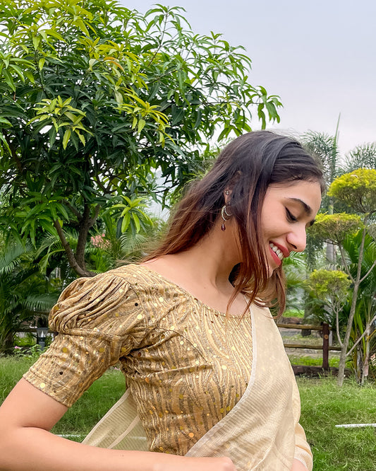 Model pairing the blouse with a saree for a festive occasion