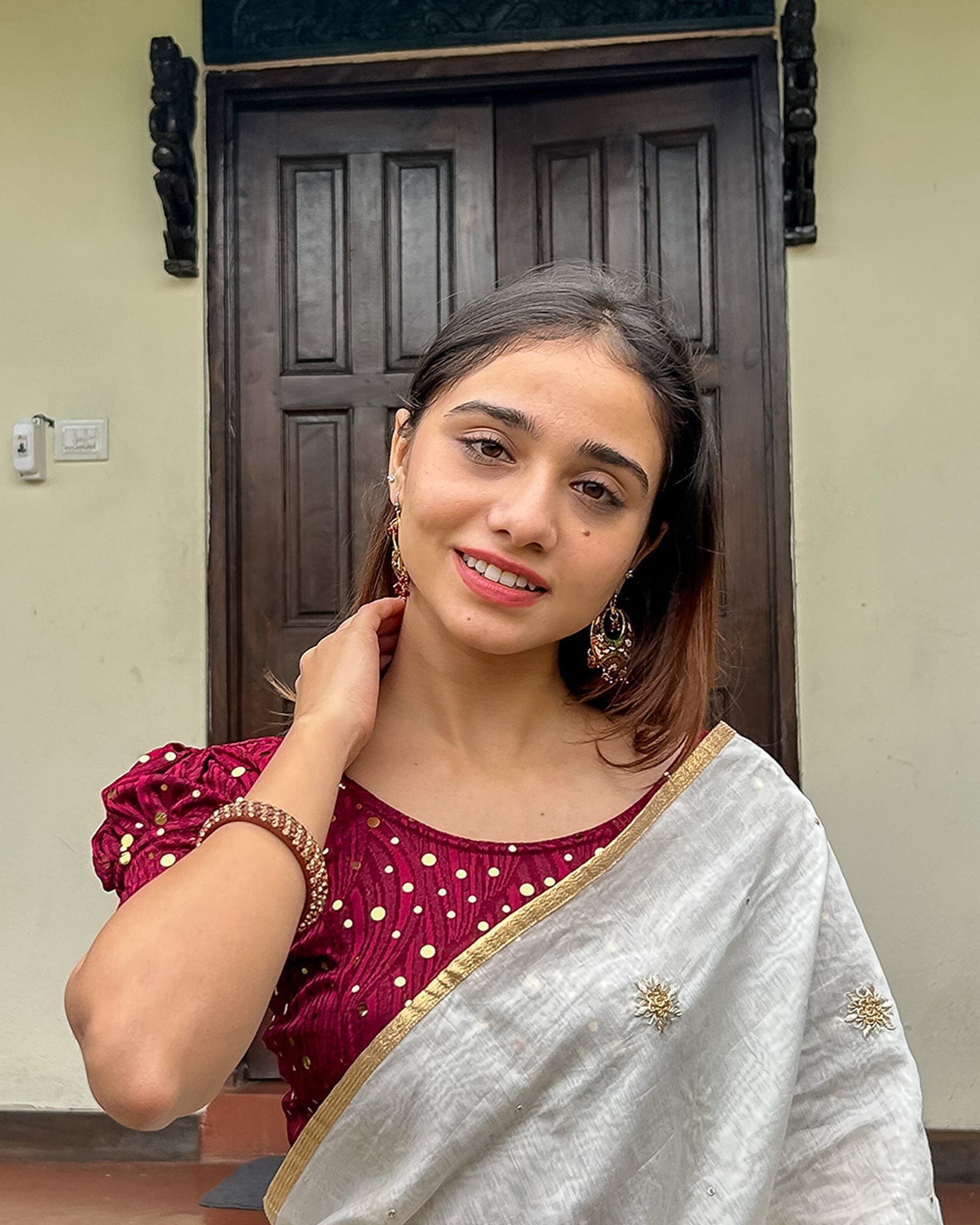 Model pairing the blouse with a saree for a festive occasion.