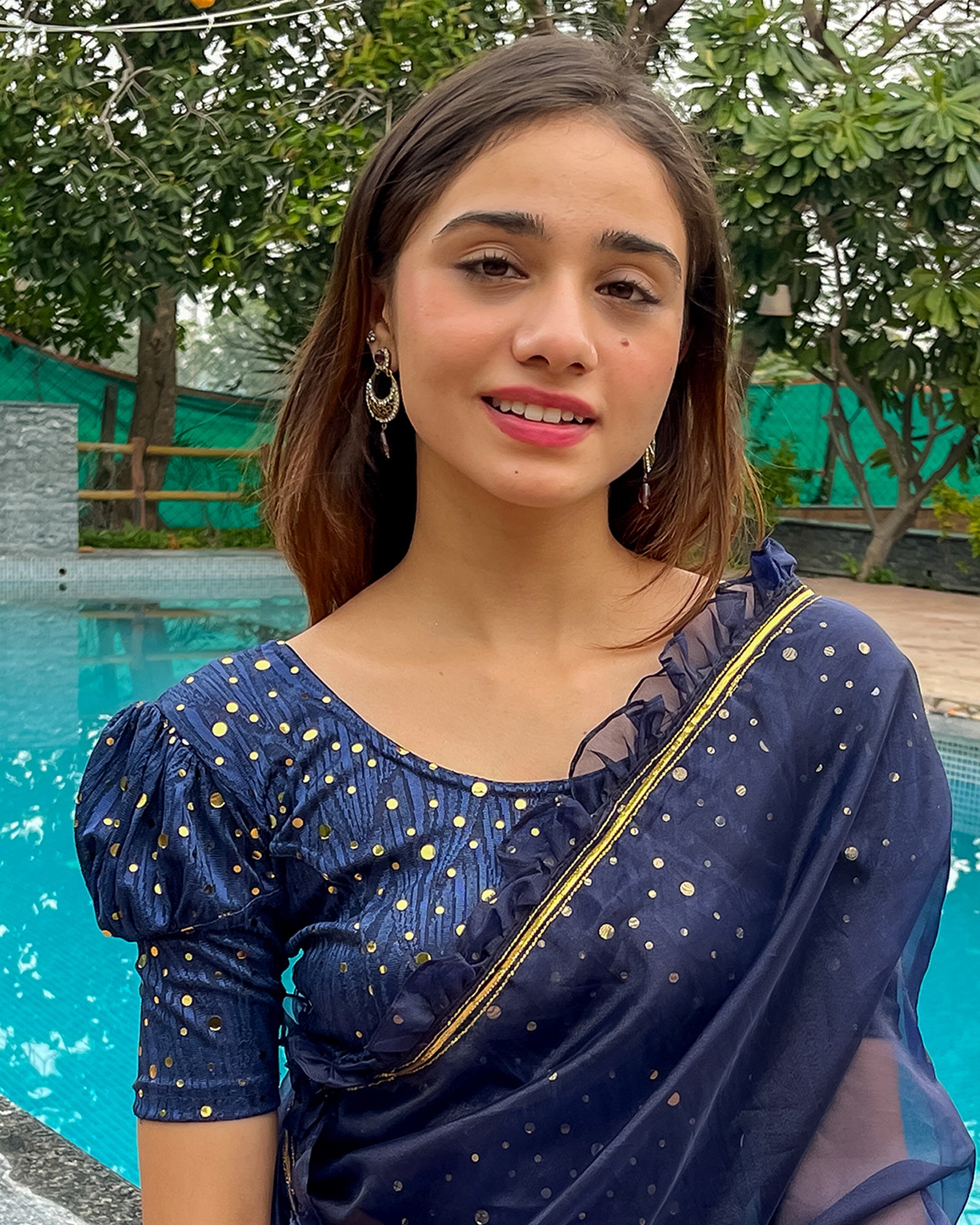 Model pairing the blouse with a saree for a festive occasion