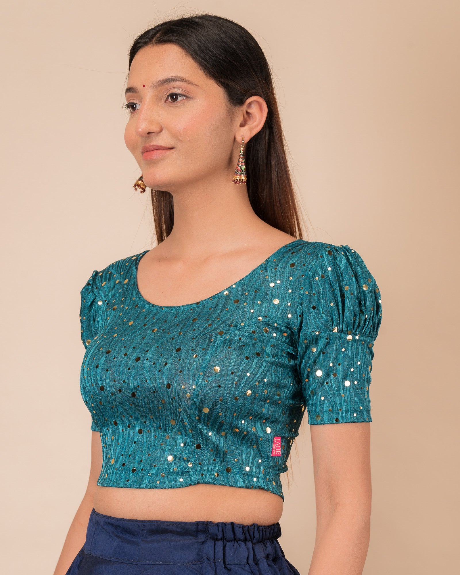 Side profile highlighting the fit and puffed sleeve silhouette