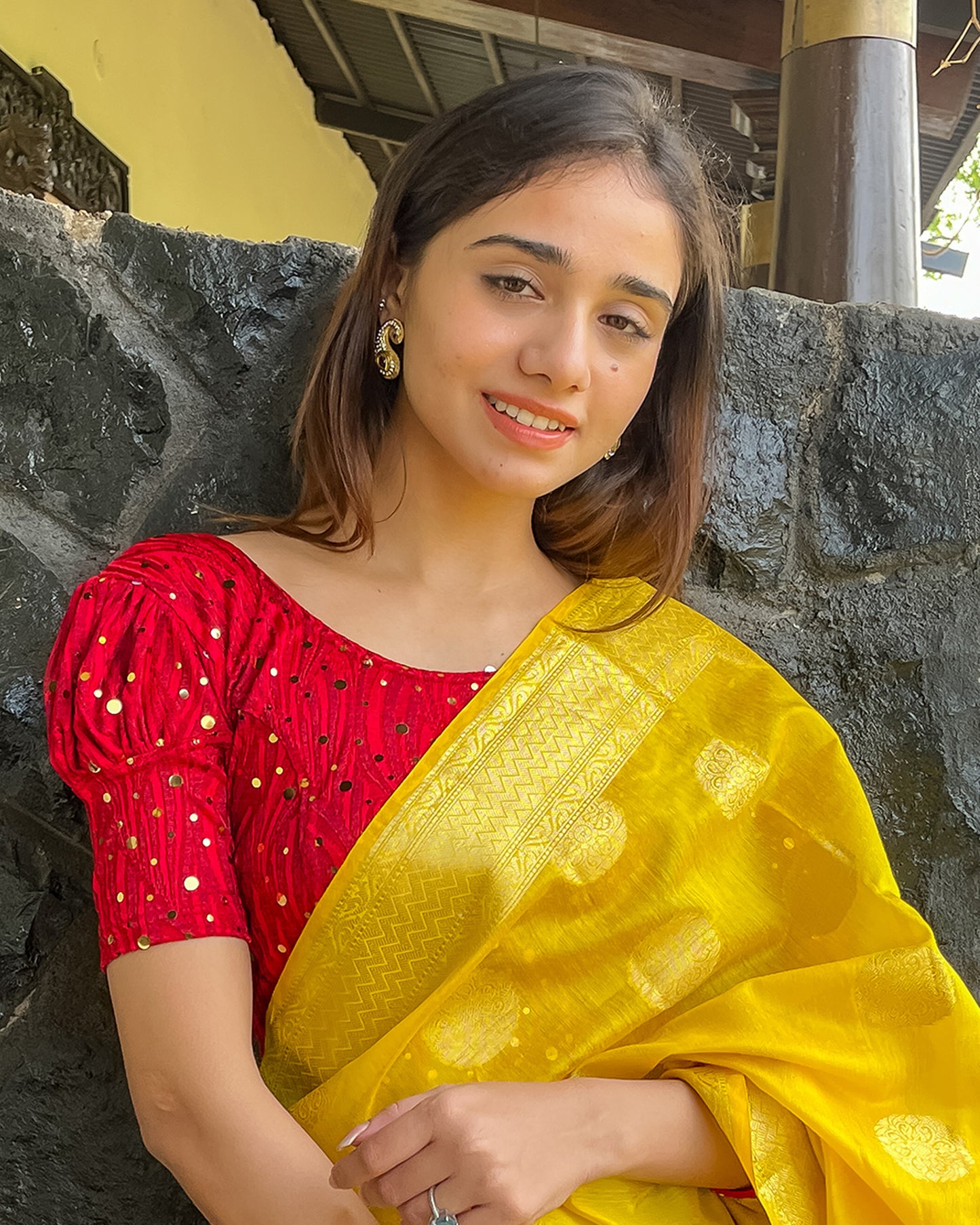  Model pairing the blouse with a saree for a festive occasion