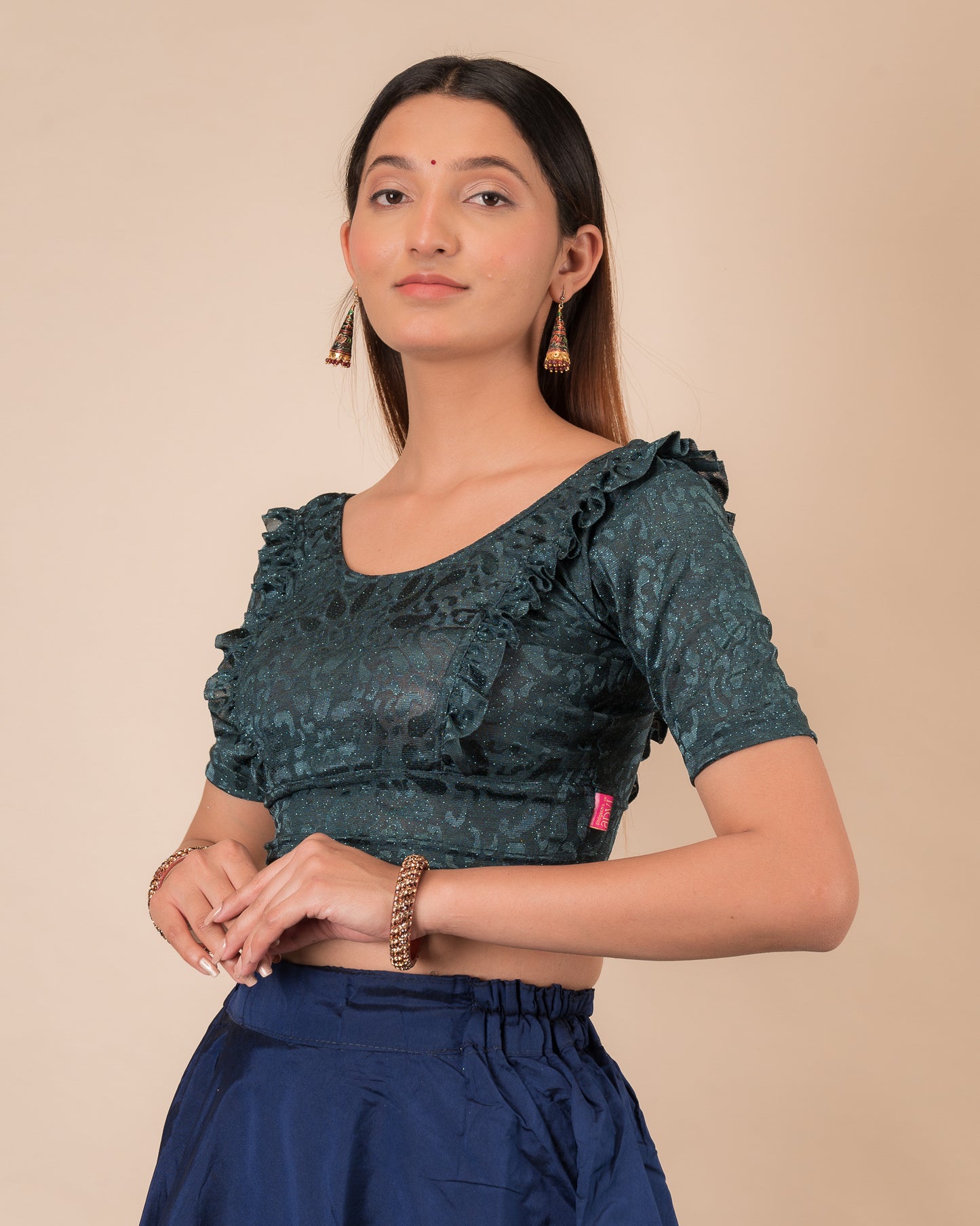  Side view highlighting the fit and shoulder ruffles