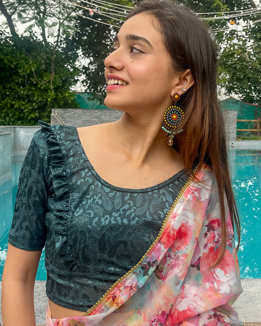 Model pairing the blouse with a saree or skirt for a festive look.