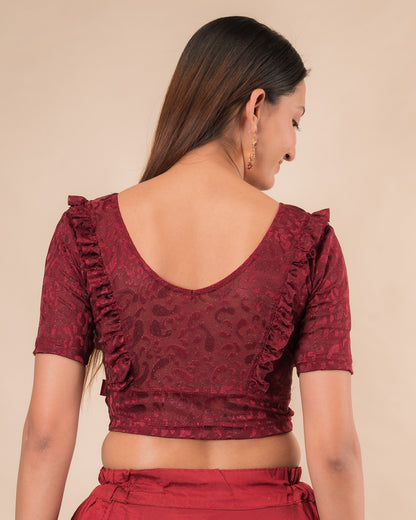 Rear view showcasing the slip-on design and ruffled shoulder detail