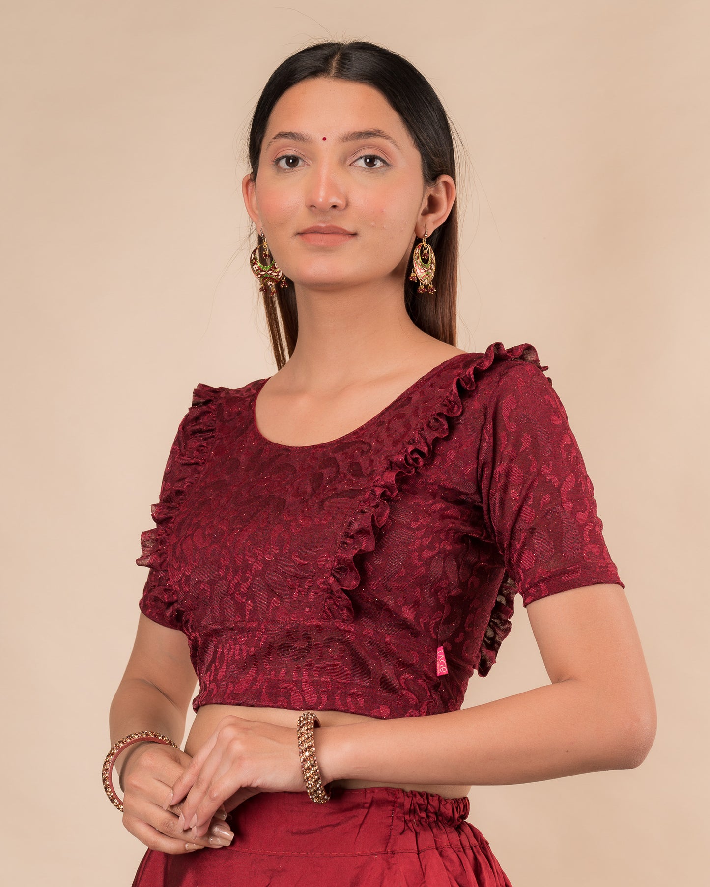 Side view highlighting the fit and shoulder ruffles