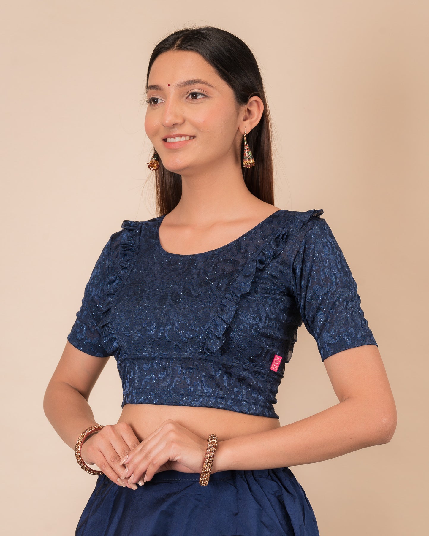 Side view highlighting the fit and shoulder ruffles