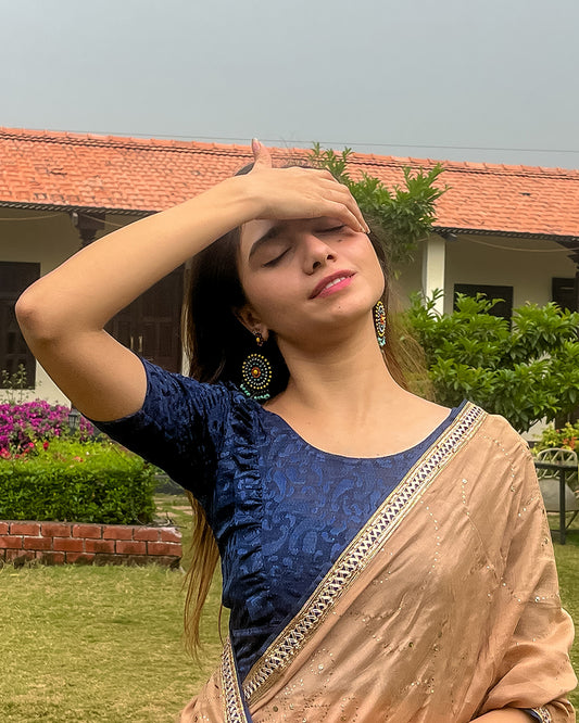 Model pairing the blouse with a saree or skirt for a festive look