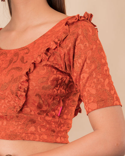 Close-up of the melange jacquard knit with subtle glitter and paisley pattern