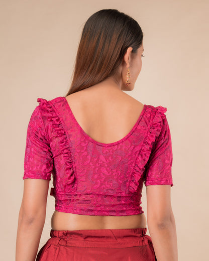 Rear view showcasing the slip-on design and ruffled shoulder detail