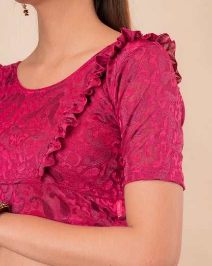 Close-up of the melange jacquard knit with subtle glitter and paisley pattern