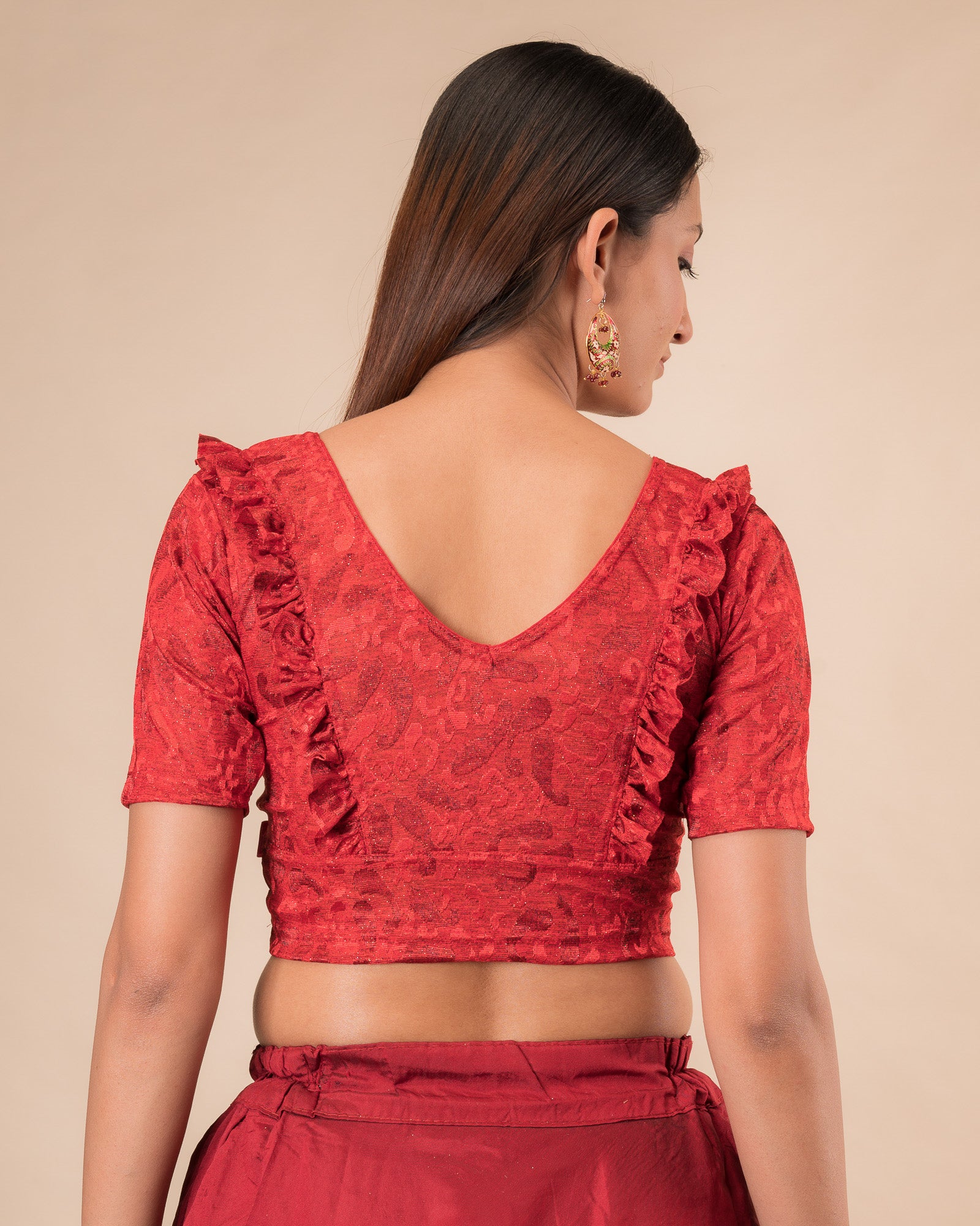 Rear view showcasing the slip-on design and ruffled shoulder detail.