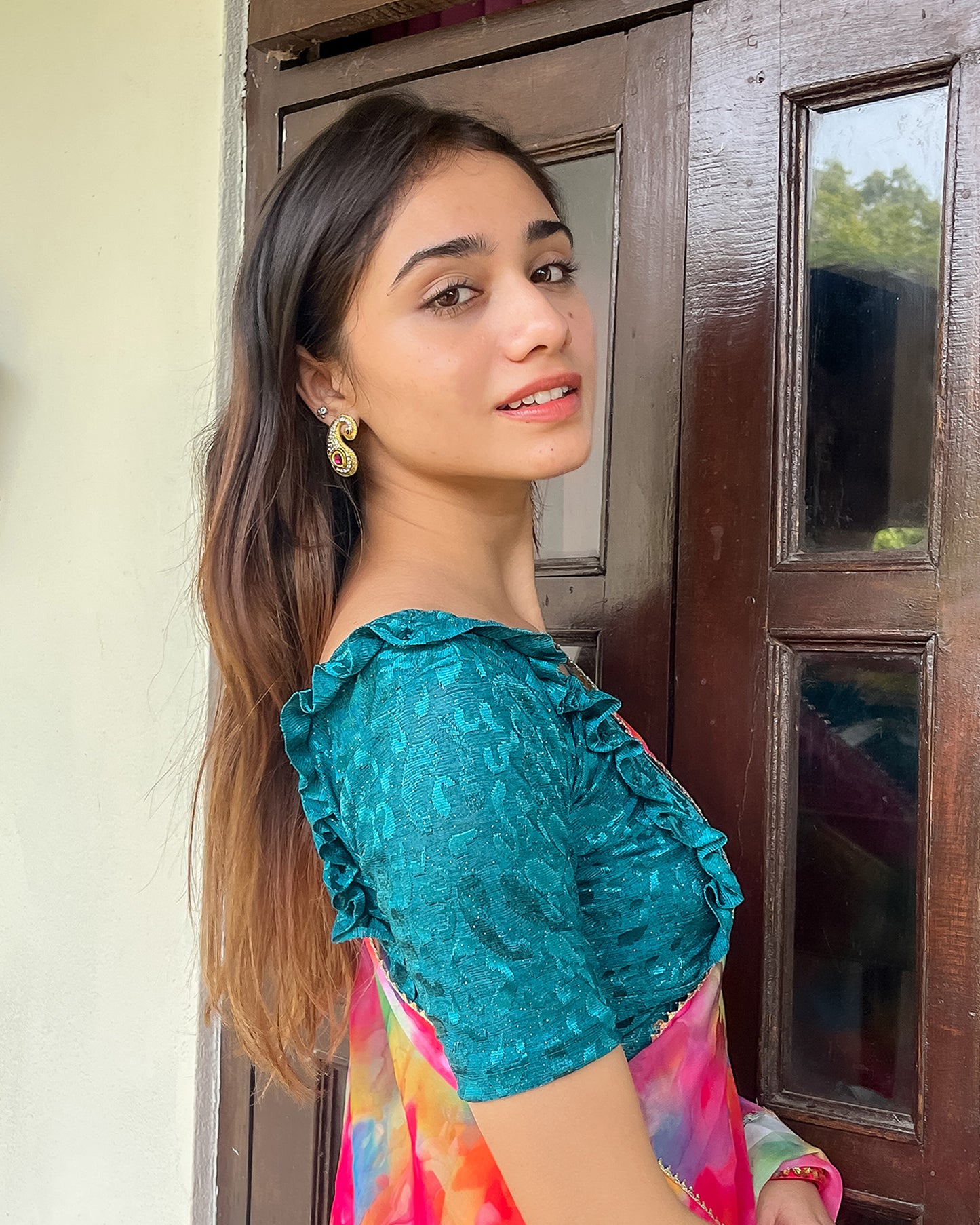 Model pairing the blouse with a saree or skirt for a festive look