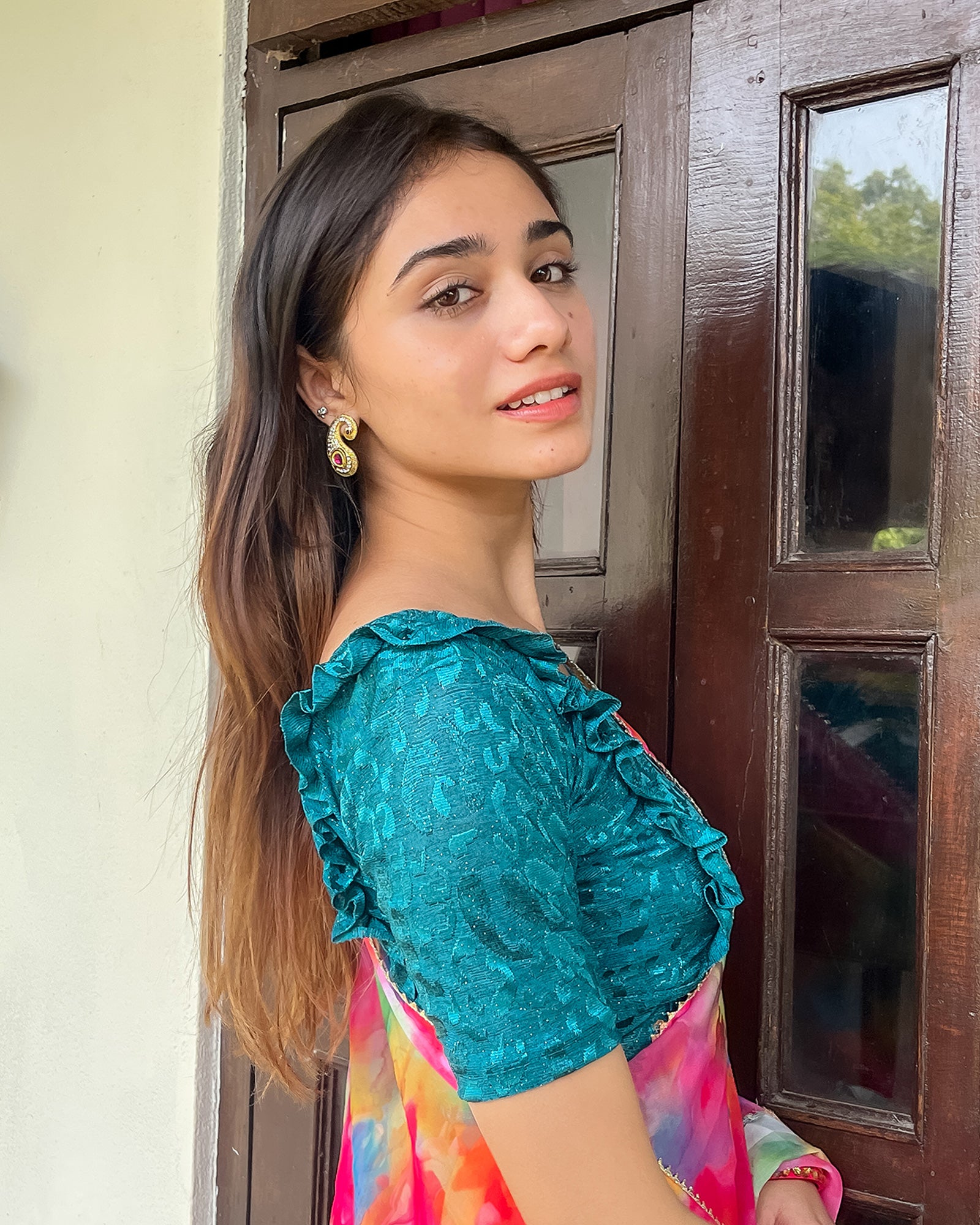 Model pairing the blouse with a saree or skirt for a festive look