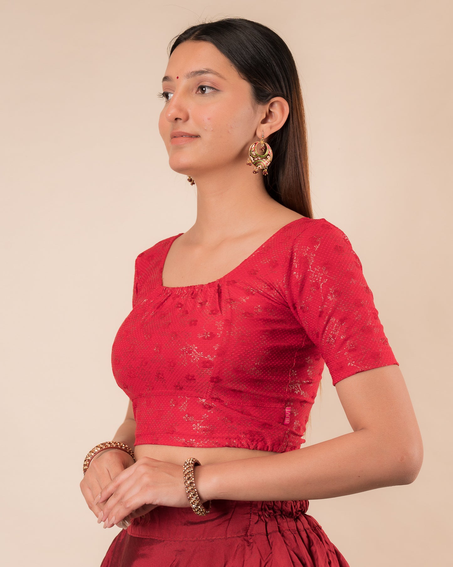 Side profile highlighting the gathered fit and sleeve length