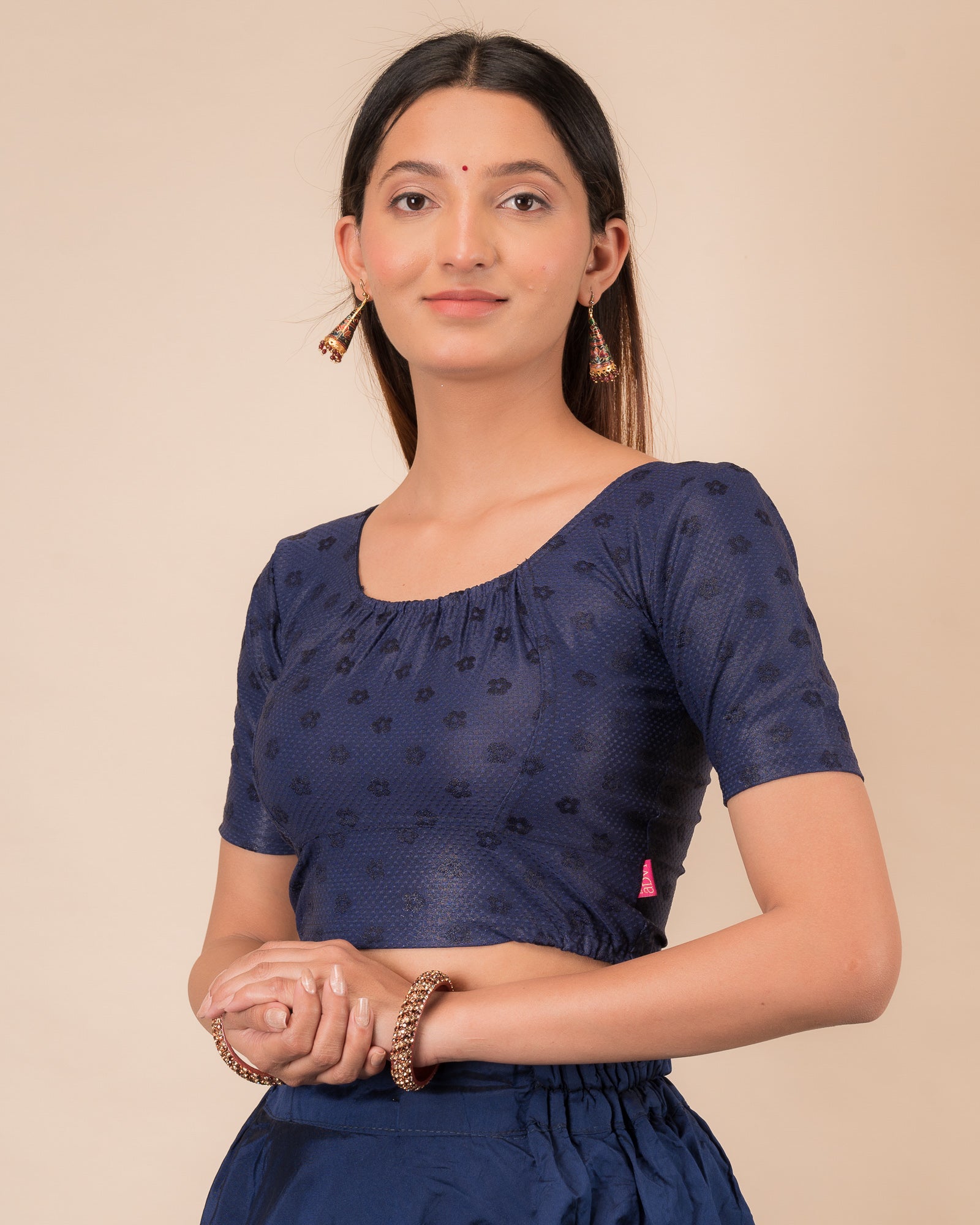 Side profile highlighting the gathered fit and sleeve length