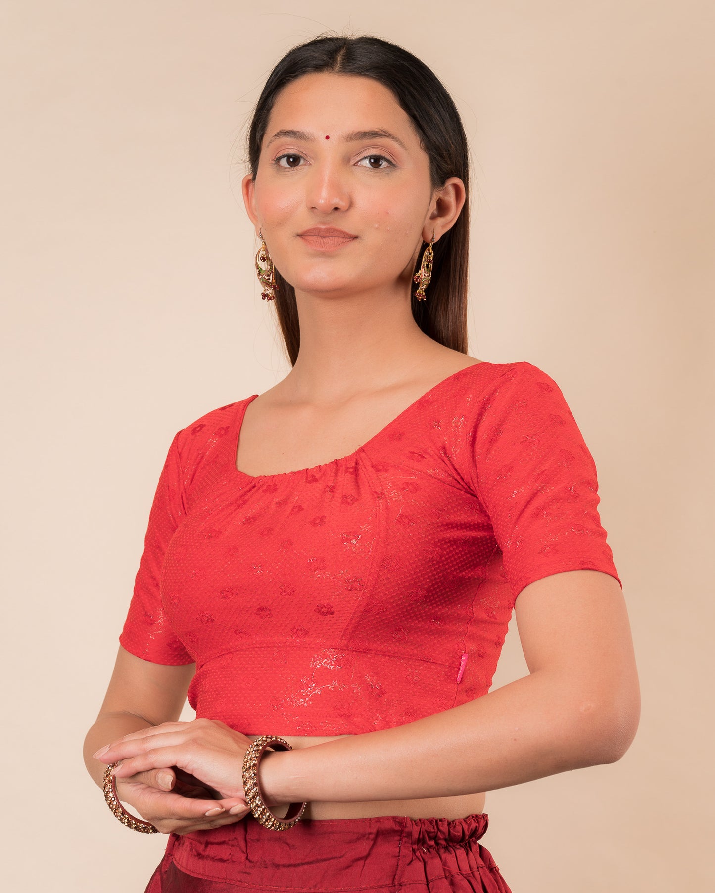 Side profile highlighting the gathered fit and sleeve length.