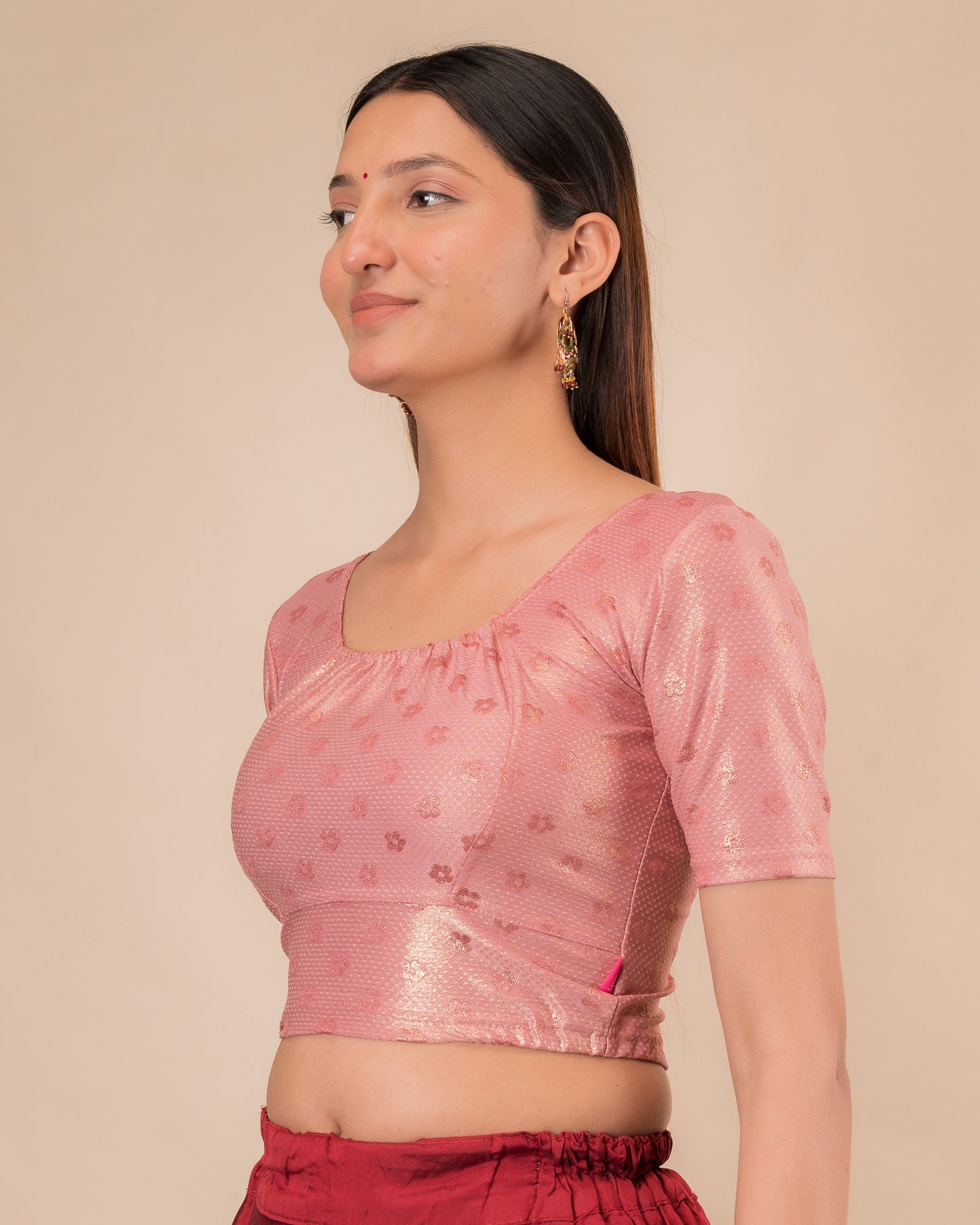 Side profile highlighting the gathered fit and sleeve length.