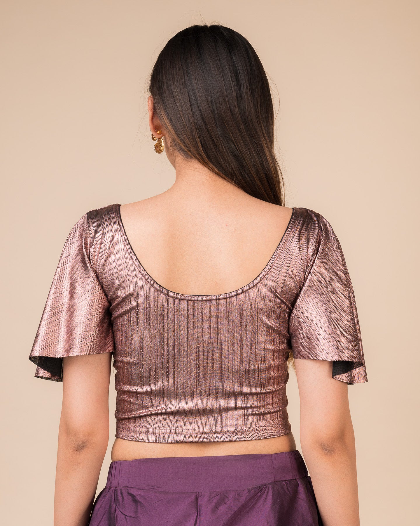 Rear view showcasing the back design and metallic stripes