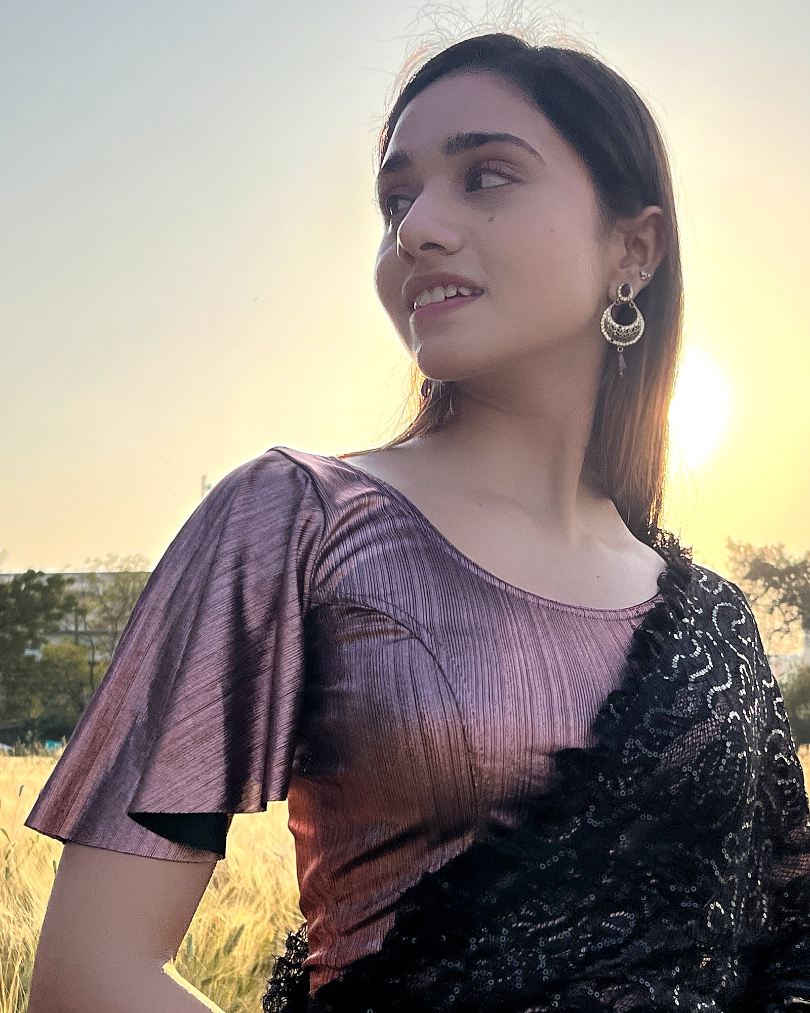 Model pairing the blouse with a saree for a festive event