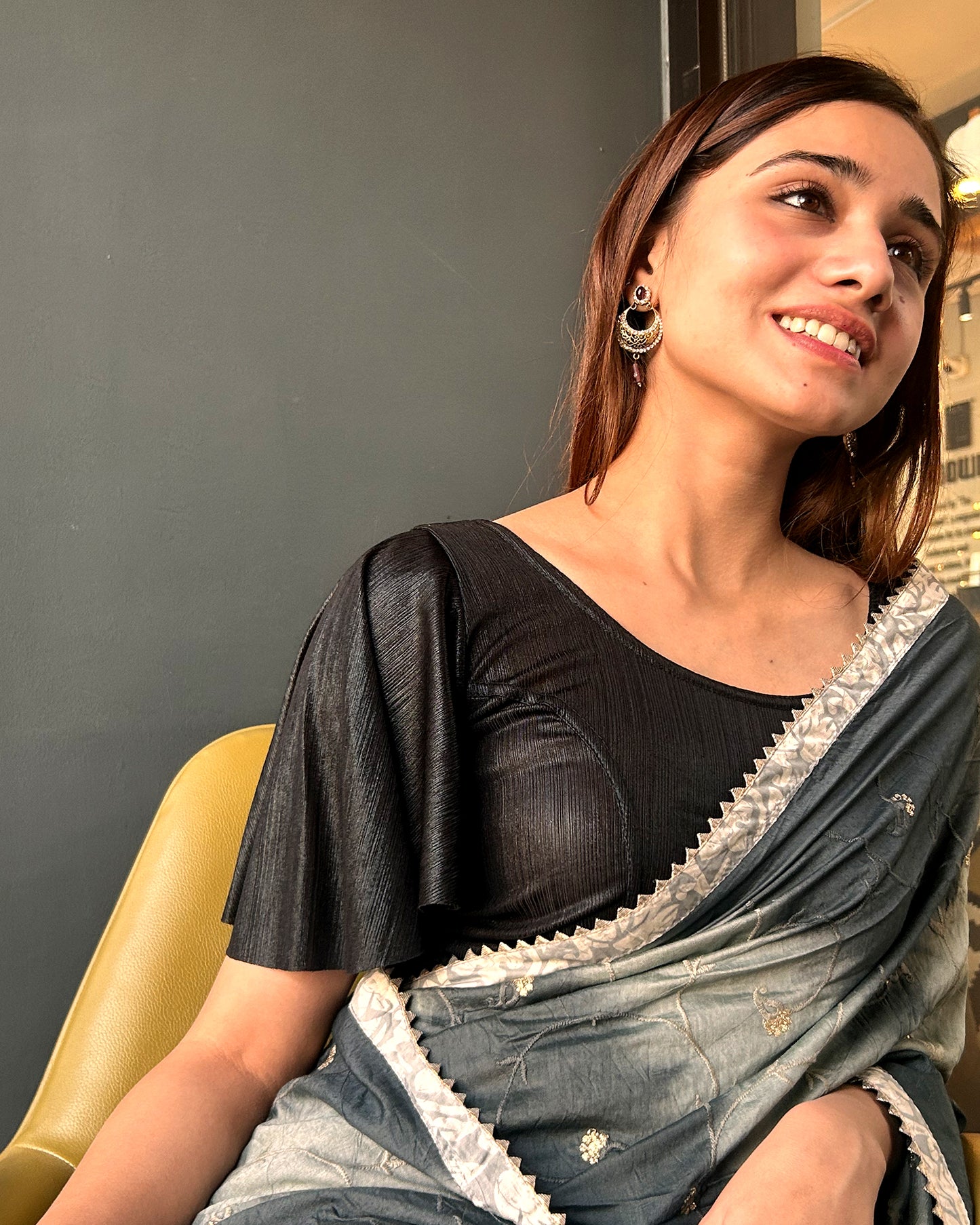 Model pairing the blouse with a saree for a festive event