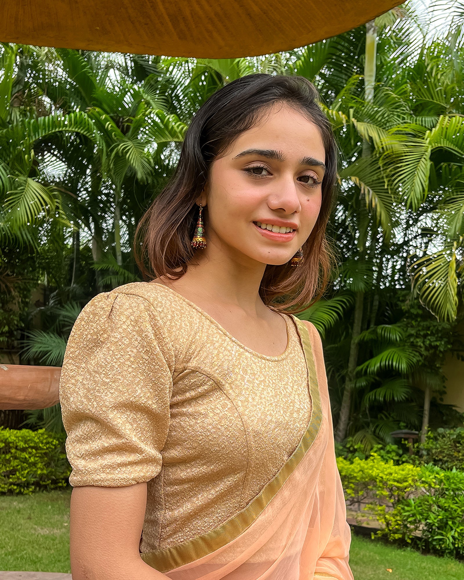  Model pairing the blouse with a saree or skirt for a festive look