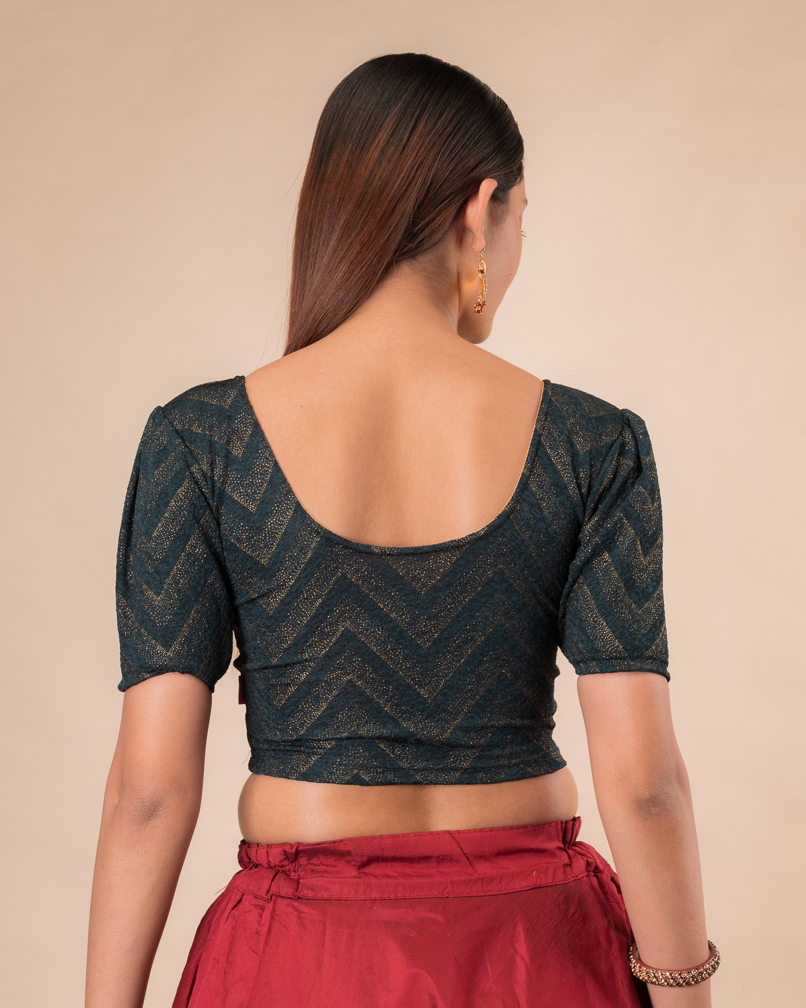 Rear view showcasing the slip-on design and ruffled shoulder detail