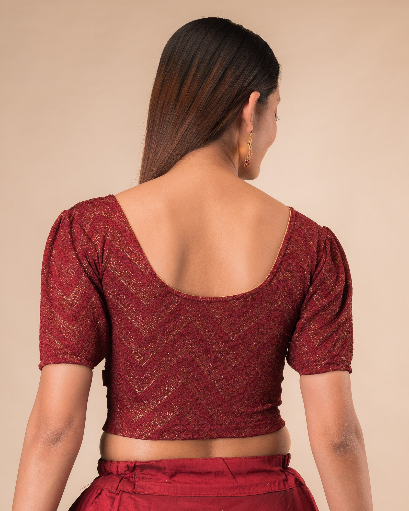 Rear view showcasing the slip-on design and ruffled shoulder detail