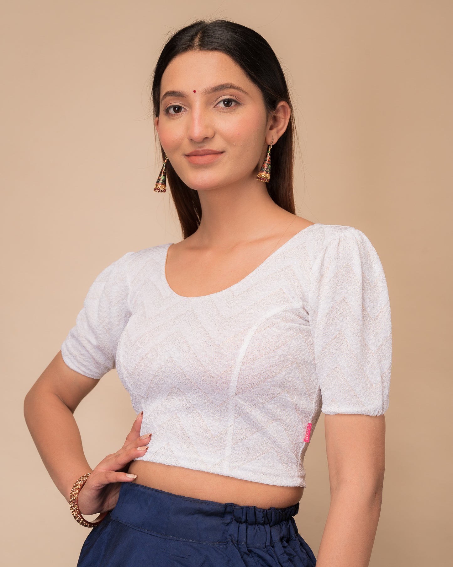 Side view highlighting the fit and shoulder ruffles