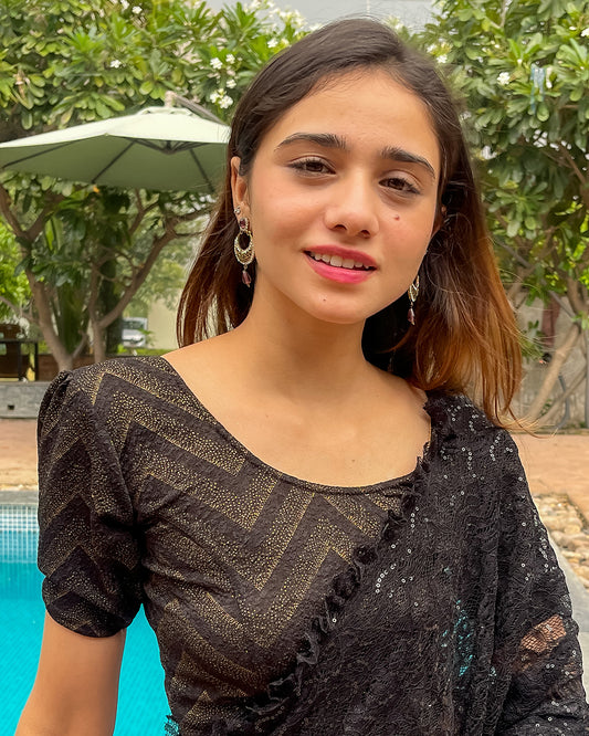  Model pairing the blouse with a saree or skirt for a festive look