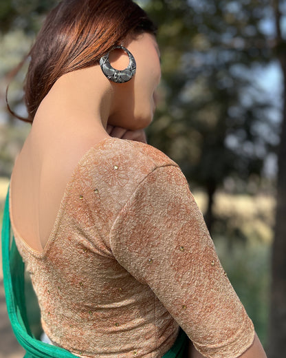 Model pairing the blouse with a festive saree for occasions