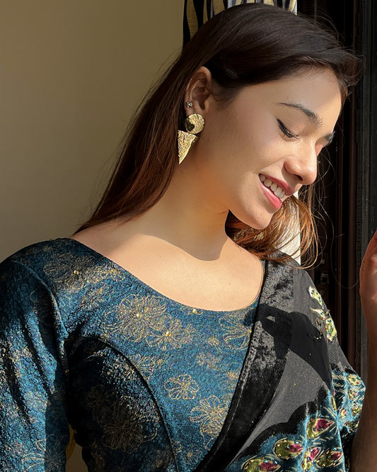 Model pairing the blouse with a festive saree for occasions
