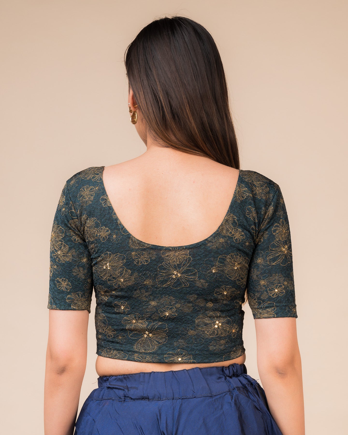 Rear view showcasing the back design texture and embellishments