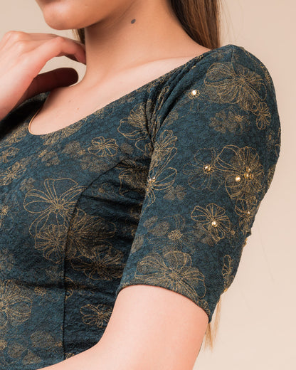 Close-up detailing the floral foil texture and stone work on jacquard fabric