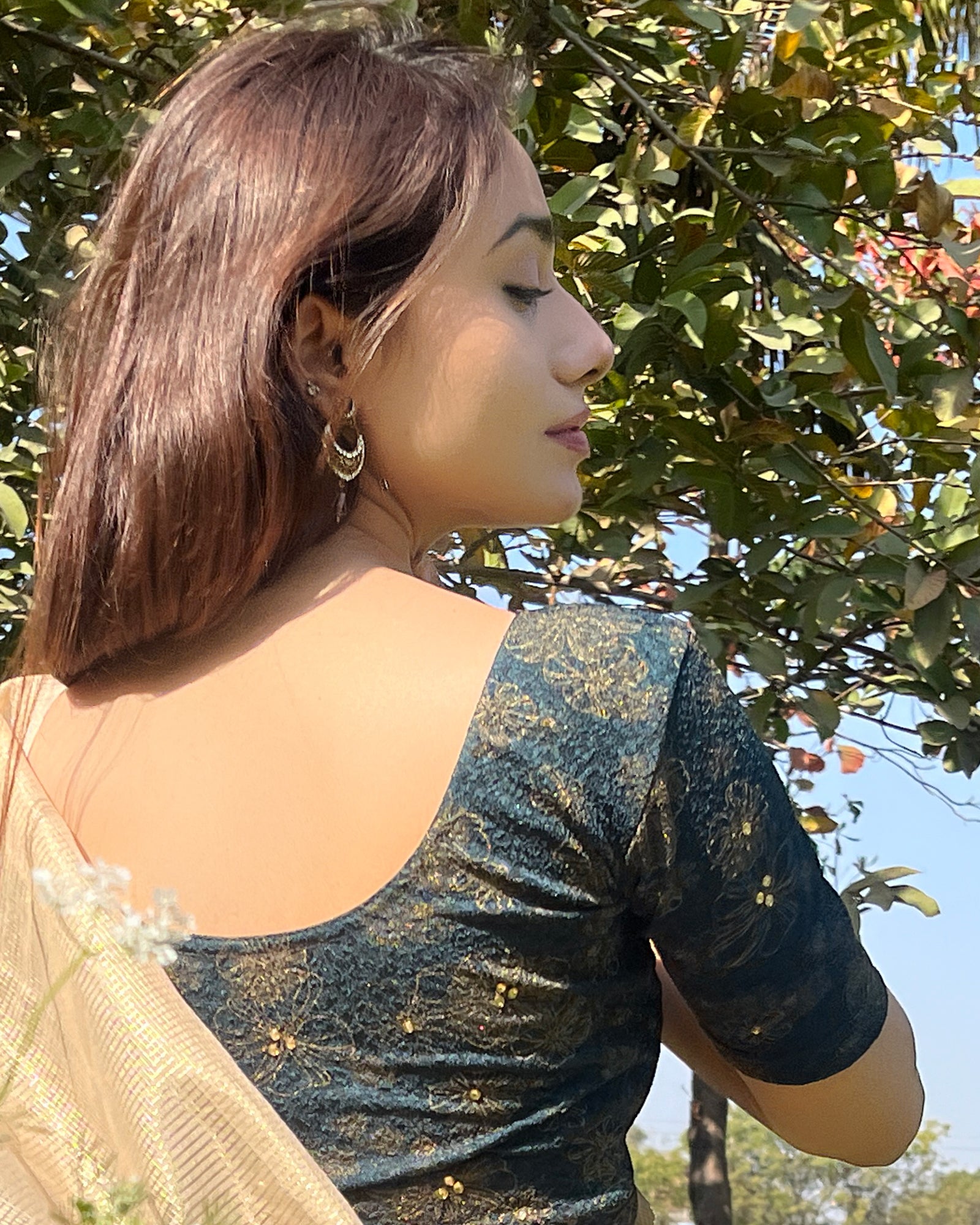 Model pairing the blouse with a festive saree for occasions