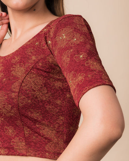 Close-up detailing the floral foil texture and stone work on jacquard fabric