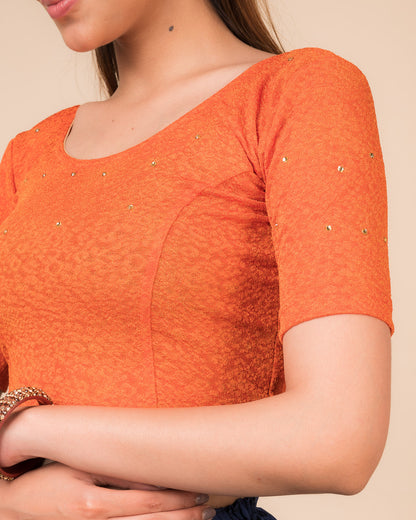 Close-up detailing the floral foil texture and stone work on jacquard fabric