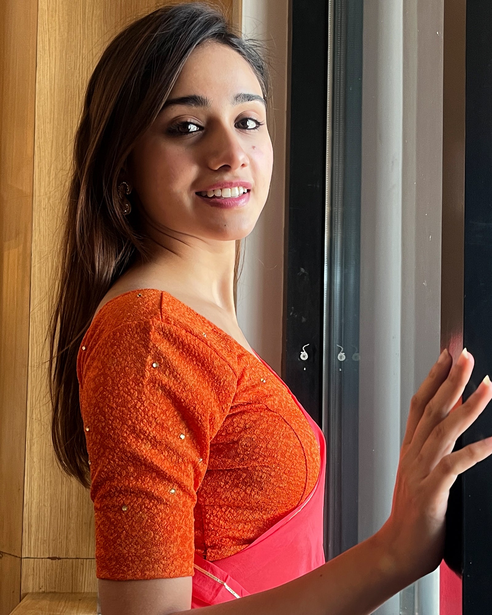 Model pairing the blouse with a festive saree for occasions