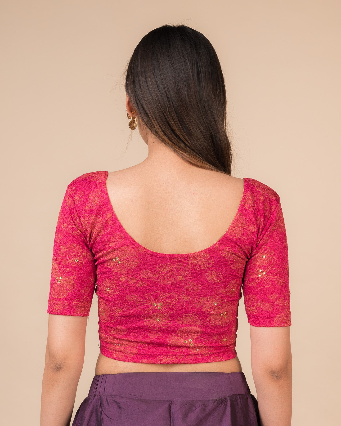 Rear view showcasing the back design texture and embellishments