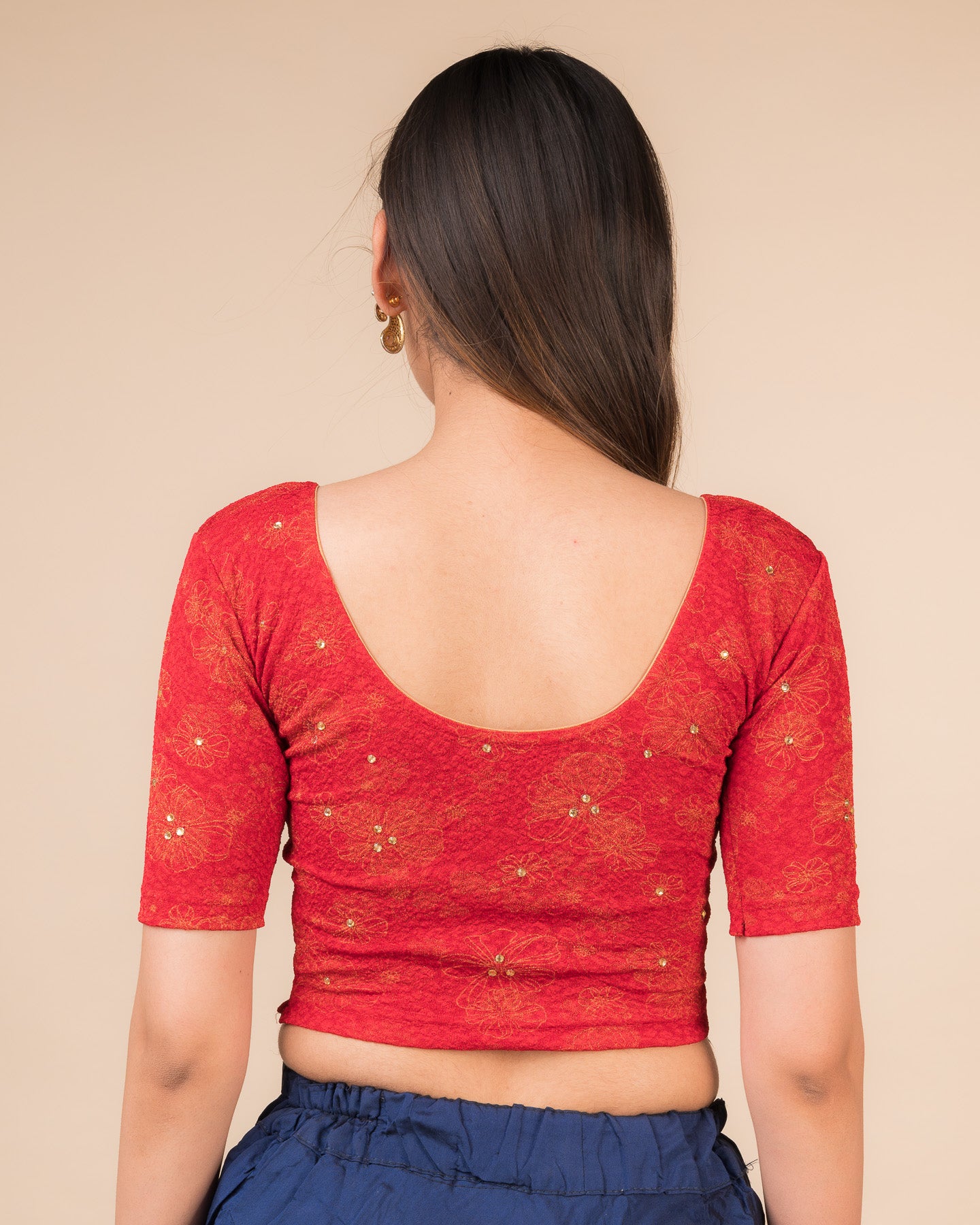 Rear view showcasing the back design texture and embellishments