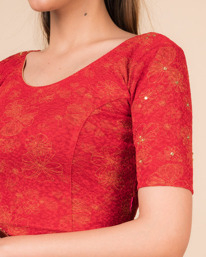 Close-up detailing the floral foil texture and stone work on jacquard fabric