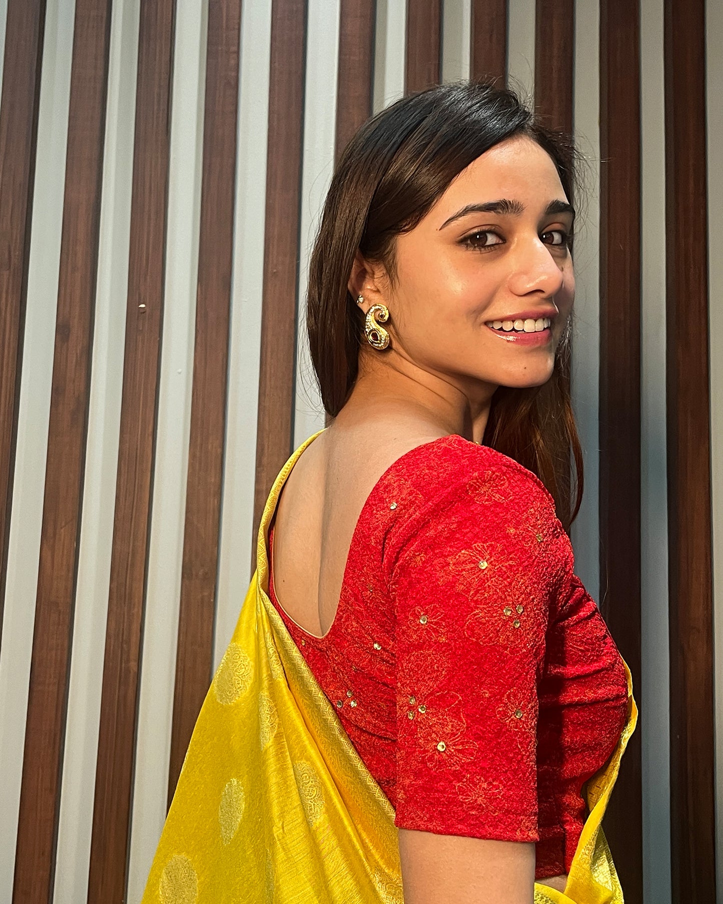 Model pairing the blouse with a festive saree for occasions