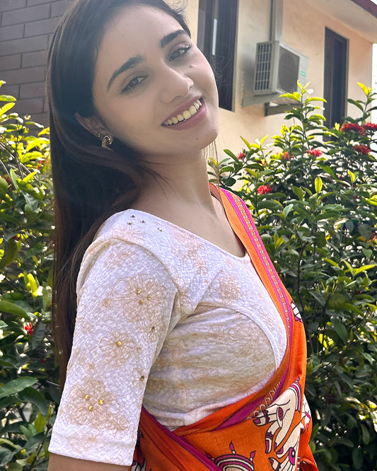 Model pairing the blouse with a festive saree for occasions