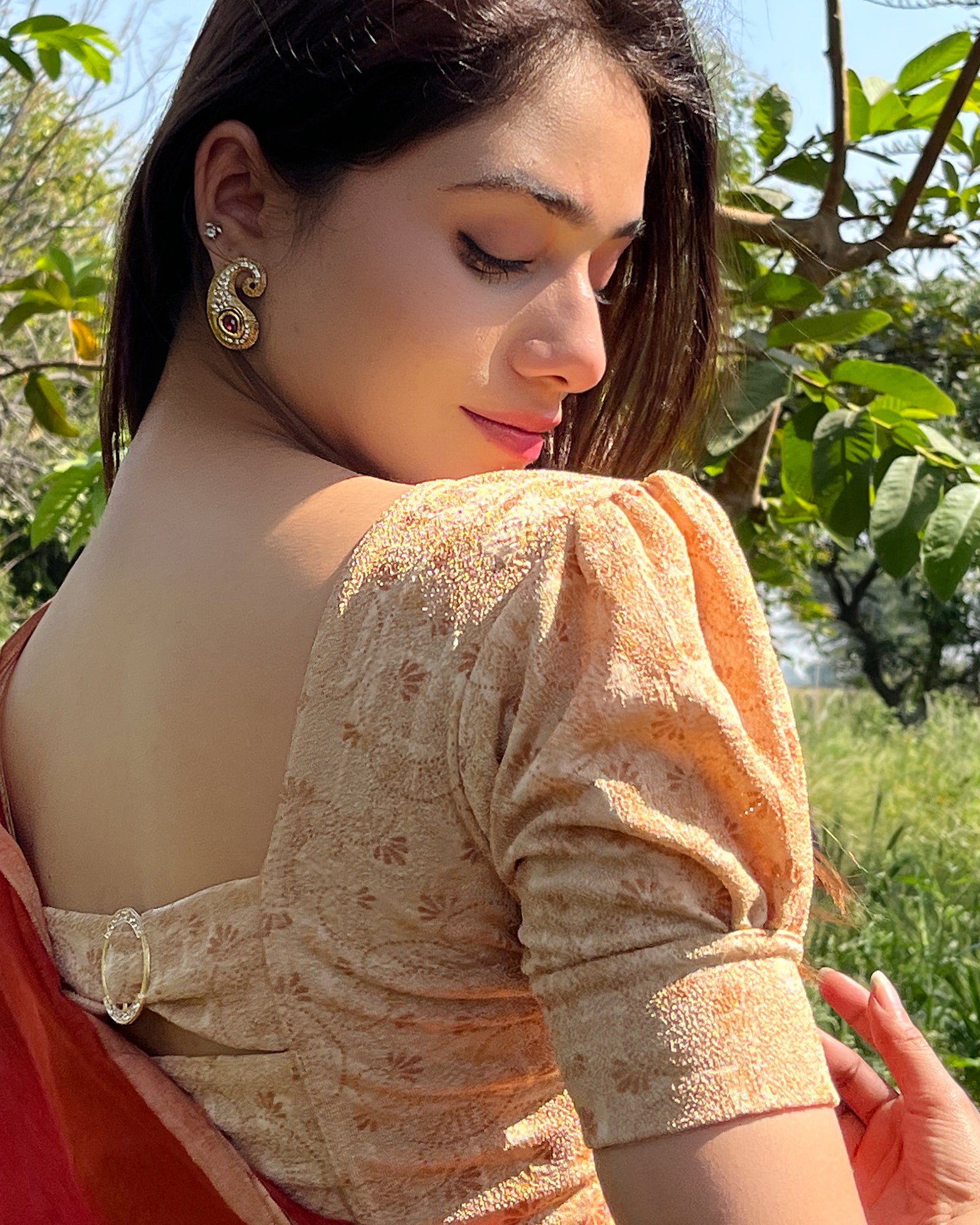 Model pairing the blouse with a saree for a refined festive look