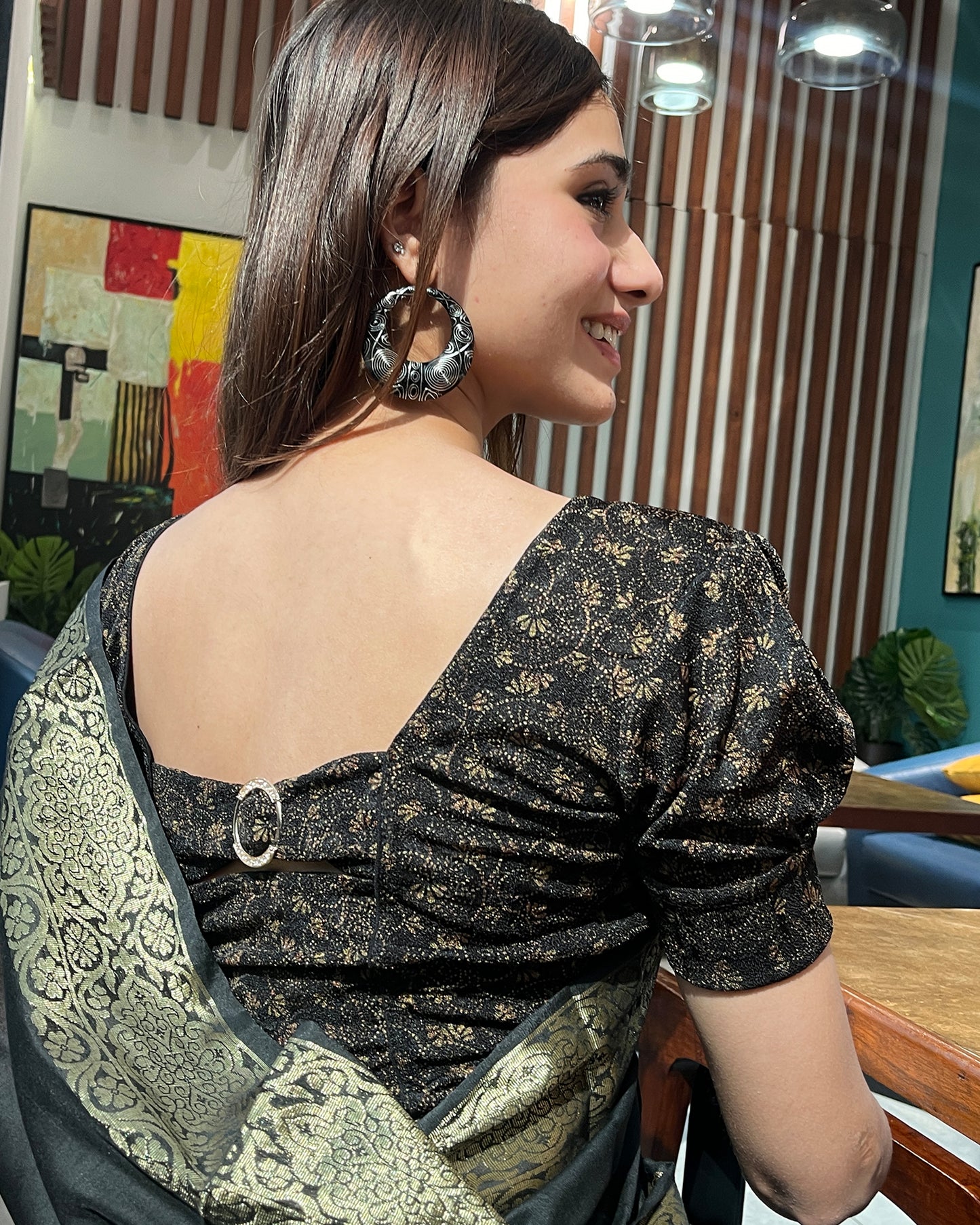 Model pairing the blouse with a saree for a refined festive look