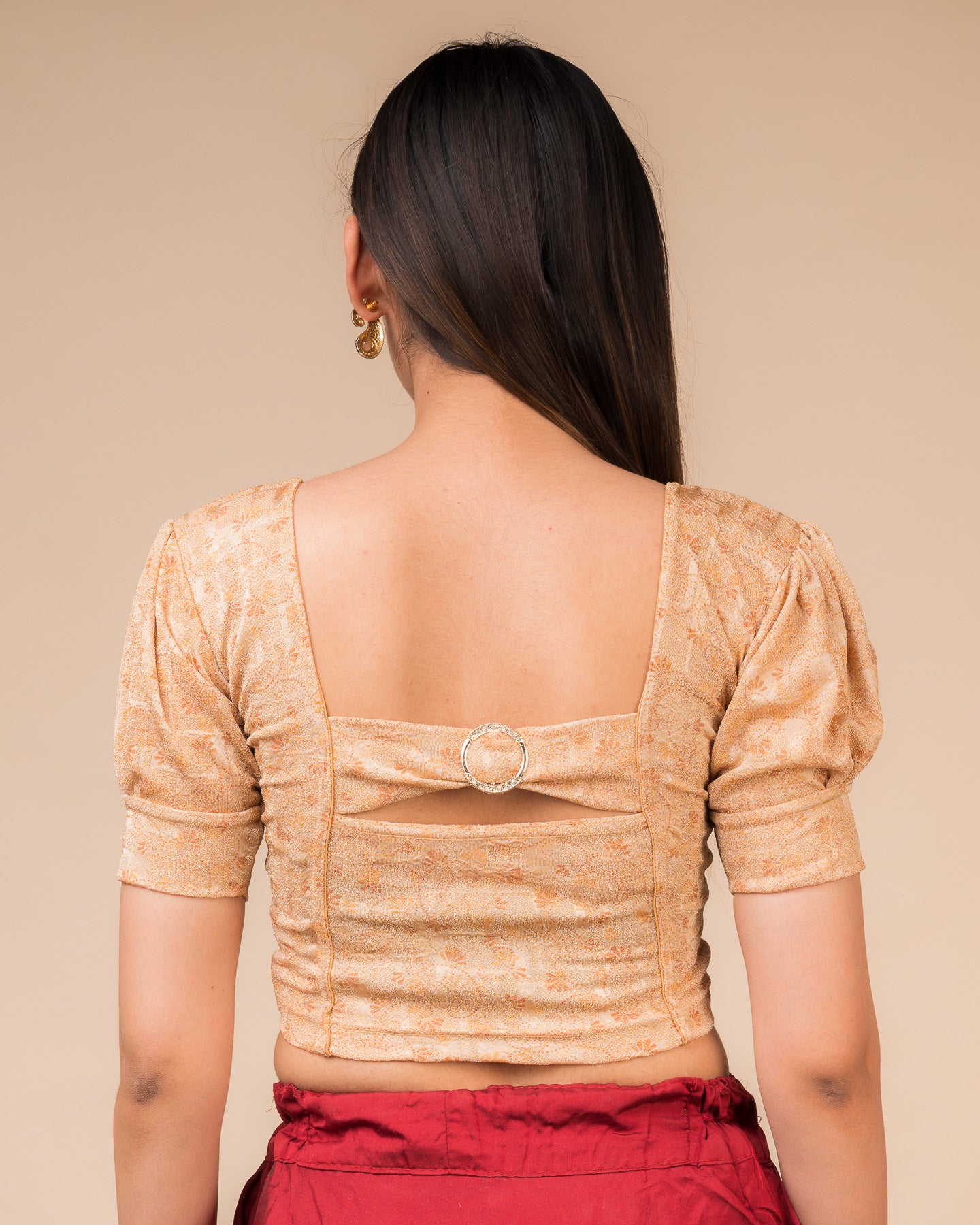 Rear view showcasing the buckle detail and peekaboo square back neckline