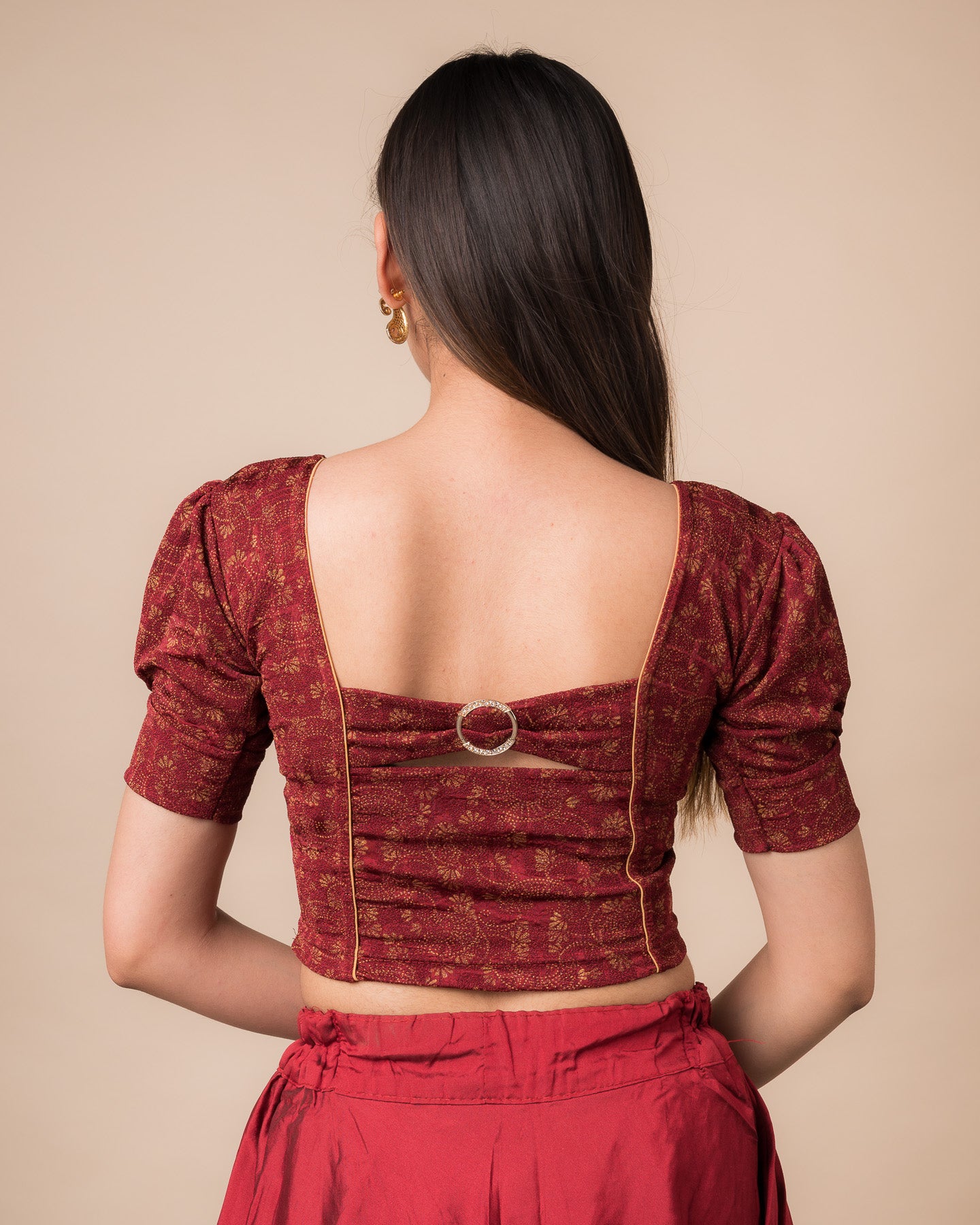 Rear view showcasing the buckle detail and peekaboo square back neckline