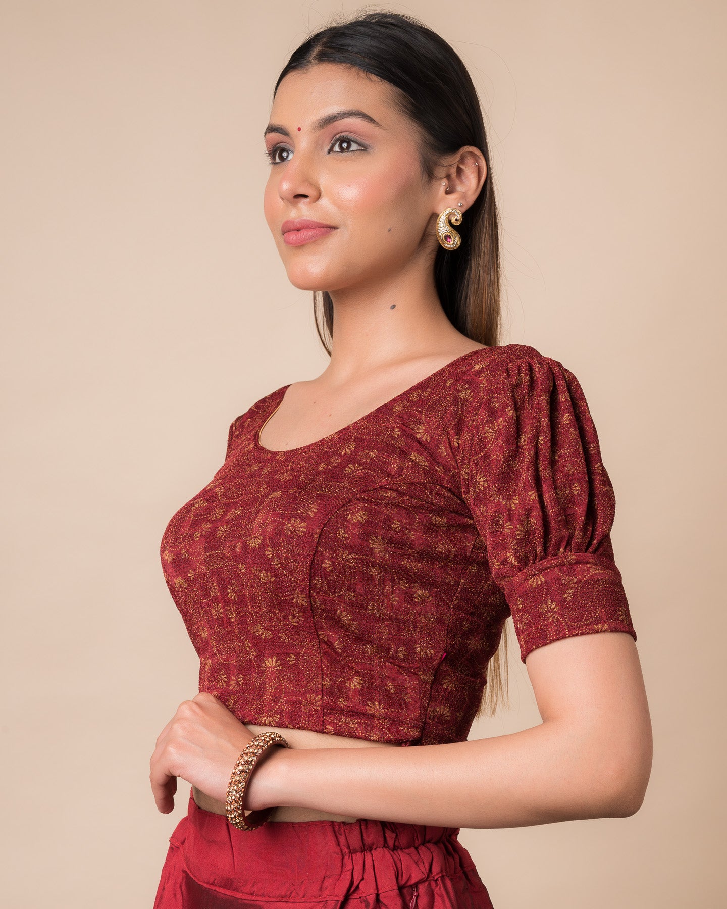 Side profile highlighting the fit, sleeve length, and back buckle feature